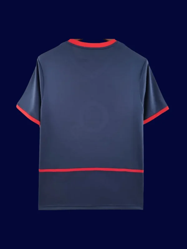 back view of blue away retro football jersey (02/04) showing plain back for numbers.