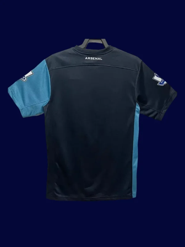 back view of away retro soccer jersey (11/12) showing plain back and number-ready surface.