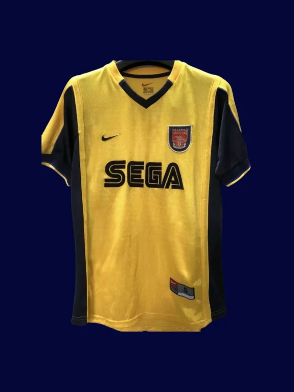 front view of yellow away retro football jersey (2000) with clean collar and retro stripes.