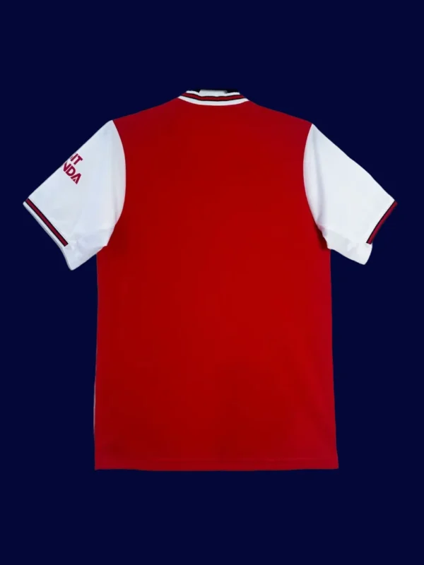 back view of red home retro football jersey (19/20) showing reinforced back and number area.