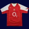 front view of red home retro football jersey with classic collar (04/05) and vintage styling.