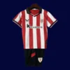 Athletic Bilbao Home Kids Kits 25/26 front view with mini club crest and kid fit.