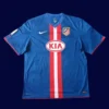 Atlético Madrid 2010 11 away retro jersey front with alternate tones and crest