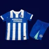 Brighton Home Kids Kits 25/26 front with mini crest and youth fit.