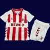 Cologne Home Kids Kits 25/26 front with mini crest and youth-friendly fit.