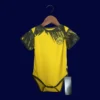 Dortmund Home Yellow Babysuit Kits 25/26 front with mini crest and youth-friendly fit.