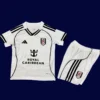 Fulham Home Kids Kits 25/26 front with mini crest and youth-friendly design.