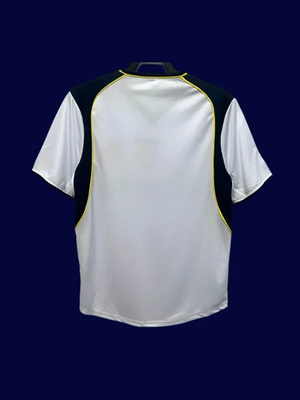 back view of away Super Cup Final retro jersey (01/02) showing number-ready back panel.