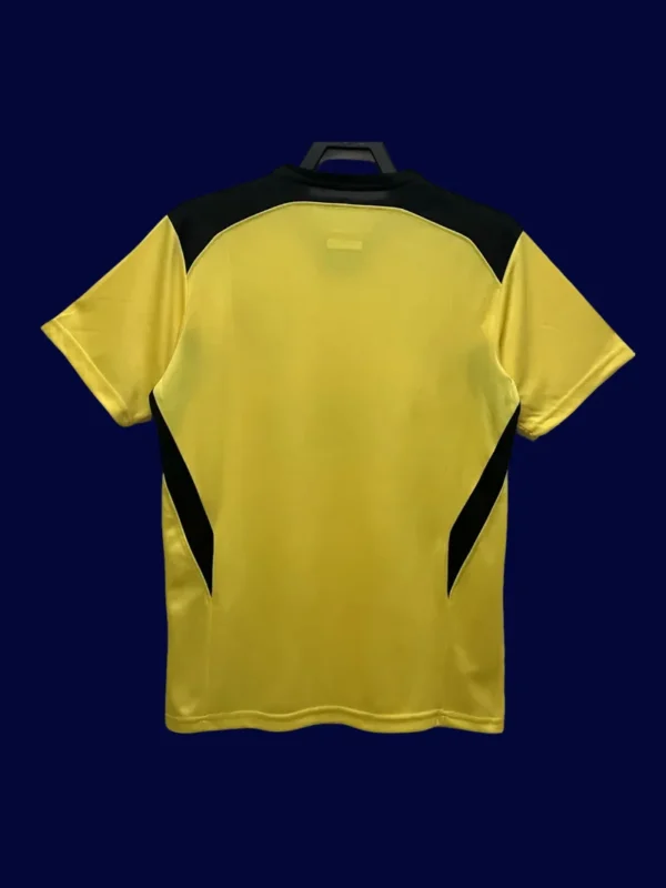 back view of Liverpool away yellow retro jersey (04/05) showing number-ready back panel.