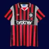 front view of Manchester City away retro jersey (94/96) in sky blue with vintage trim.