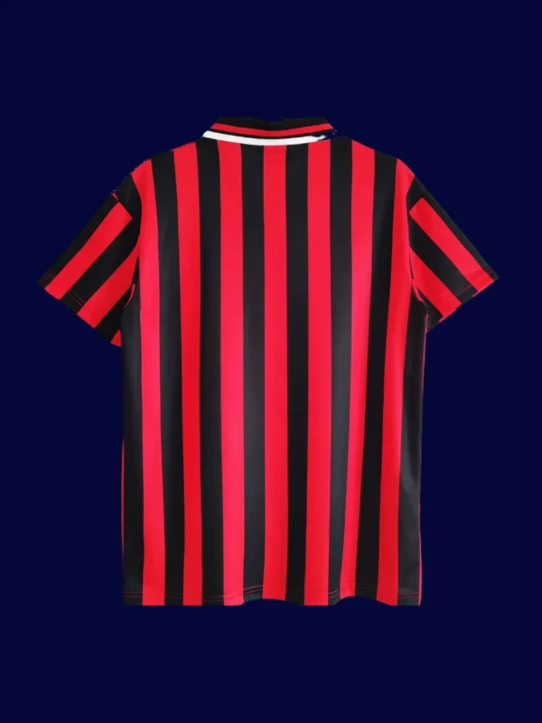 back view of Manchester City away retro jersey (94/96) showing reinforced back panel.