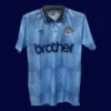 front view of Manchester City home blue retro shirt (1989) with classic collar.