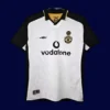 front view of Manchester United 100th Centenary retro jersey (01/02) in red with commemorative detailing.