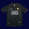 front view of Manchester United away black retro jersey (07/08) with classic trims.