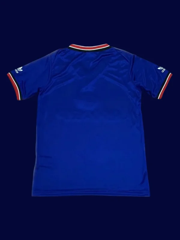 back view of away blue retro jersey (1984) showing plain back and number panel.