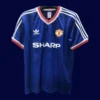 front view of Manchester United away blue retro jersey (86/88) with classic retro collar.