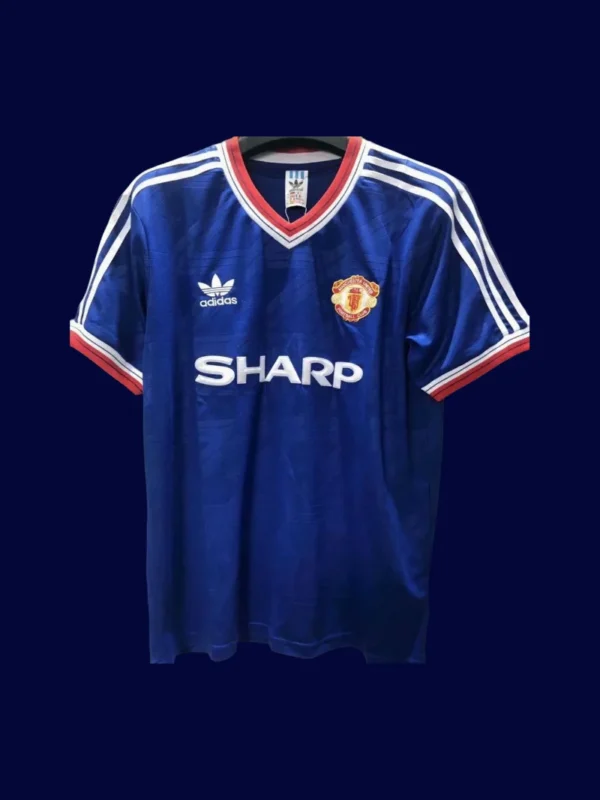 front view of Manchester United away blue retro jersey (86/88) with classic retro collar.