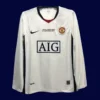front view of Manchester United away UCL retro long sleeve jersey (08/09) with blue base and vintage trims.