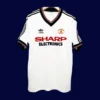 front view of Manchester United away white retro jersey (82/83) with vintage collar and trim.