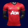 front view of Manch2ester United home red player-fit retro jersey (12/13) with slim athletic cut.