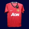 front view of Manch2ester United home red player-fit retro jersey (12/13) with slim athletic cut.