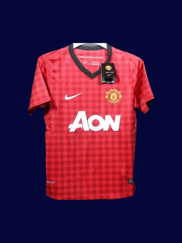 front view of Manch2ester United home red player-fit retro jersey (12/13) with slim athletic cut.