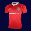 front view of Manchester United home red retro jersey (1999) with traditional collar.