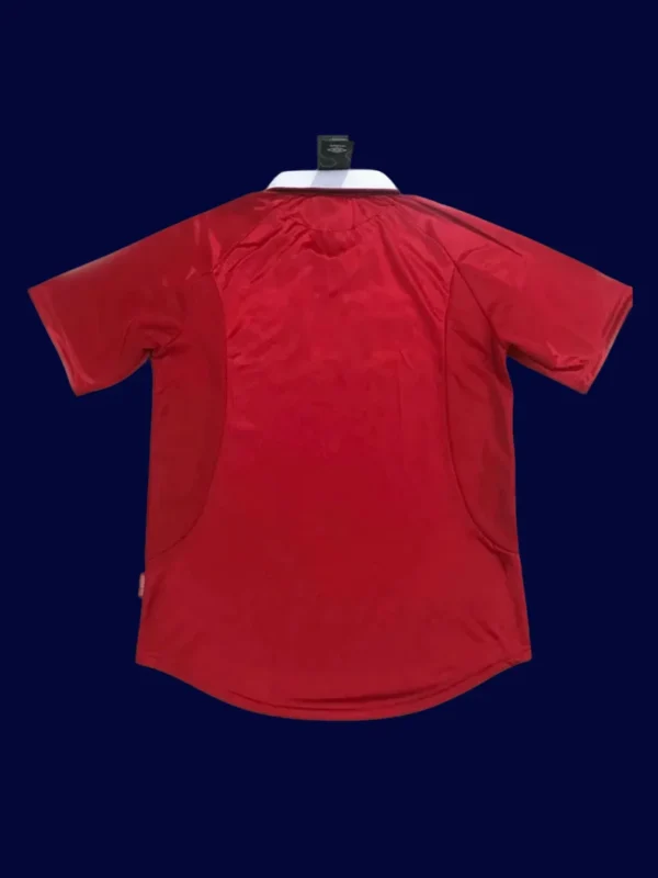 back view of home red retro jersey (1999) showing stitched back and number panel.