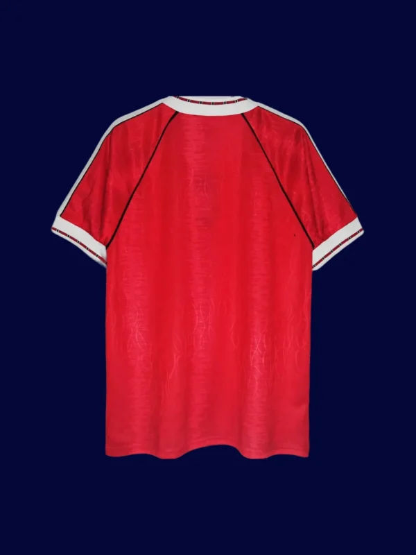 back view of home red retro jersey (90/92) showing stitched back and number-ready area.