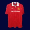 front view of Manchester United home red retro jersey (92/94) with classic V-neck.