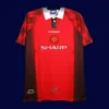front view of Manchester United home retro jersey (96/97) in red with classic trims.