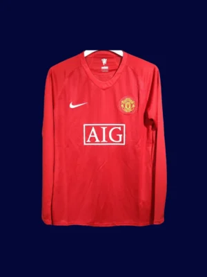 front view of Manchester United home retro long sleeve player-fit jersey (07/08) in red.