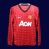 front view of Manchester United home retro long sleeve player-fit jersey (12/13) in red.