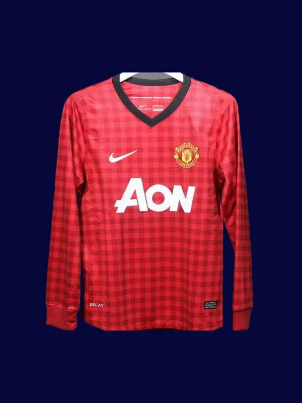 front view of Manchester United home retro long sleeve player-fit jersey (12/13) in red.