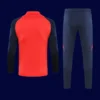 back view of red Manchester United tracksuit (2025) showing clean back panel and ergonomic seams.