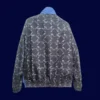 back view of reversible windbreaker (2025) showing reverse plain side and tidy seams.