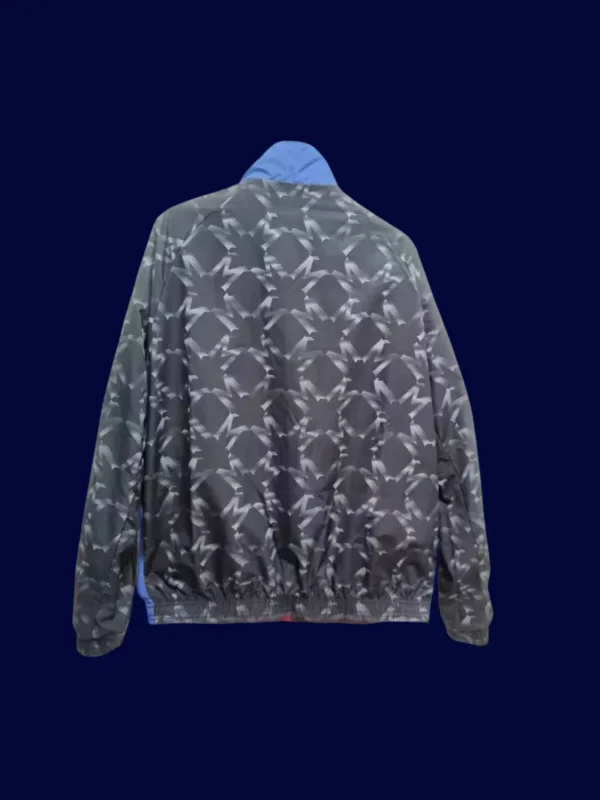 back view of reversible windbreaker (2025) showing reverse plain side and tidy seams.