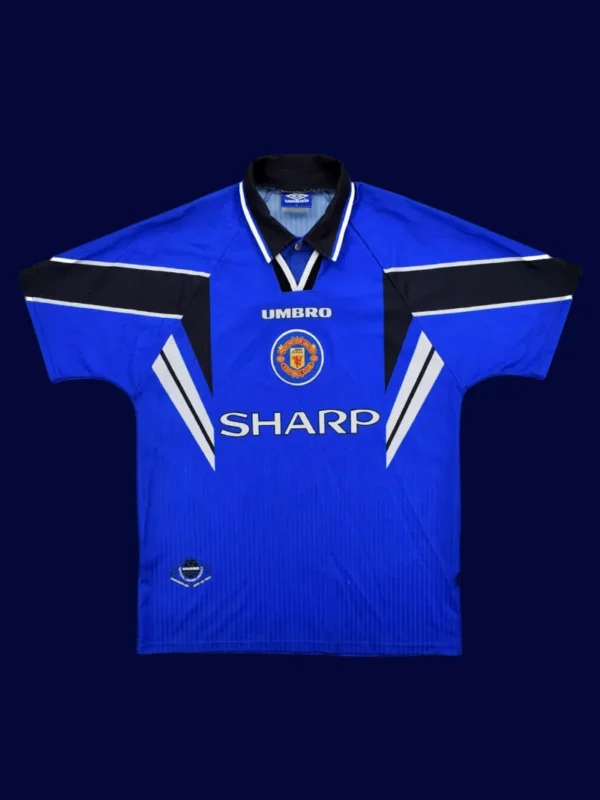 front view of Manchester United third blue retro jersey (96/98) with crew neck and retro trims.