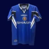 front view of Manchester United third blue retro jersey (96/98) with crew neck and retro trims.