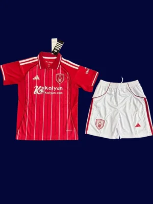 Nottingham Forest Red Home Kids Kits 25/26 front with mini crest and youth-friendly design.