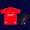 Osasuna Home Kids Kits 25/26 front view with mini crest and youth fit.
