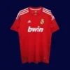 front view of red away retro football jersey (11/12) with contrast trims and classic sponsor-free look.