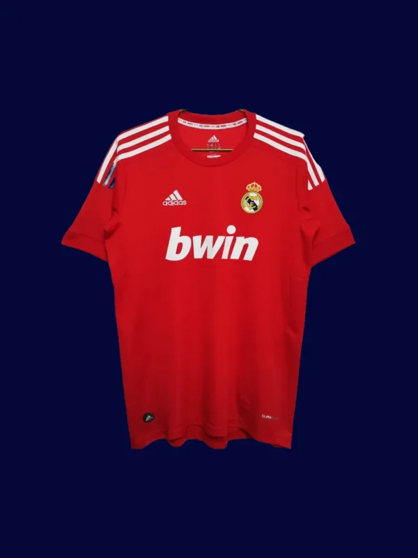 front view of red away retro football jersey (11/12) with contrast trims and classic sponsor-free look.