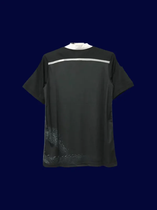back view of black dragon retro football jersey (14/15) showing patterned back and number-ready panel.