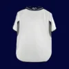 back view of white retro football jersey (00/01) showing stitched back panel and slim fit tail.