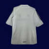back view of white home retro football jersey (05/06) showing tidy back panel and number-ready surface.