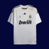 front view of white home retro football jersey (09/10) with retro striping and V-neck.