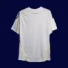 back view of white home retro football jersey (09/10) showing reinforced stitching for numbers.