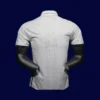 back view of white home player-fit retro jersey (16/17) showing reinforced seams for numbers.