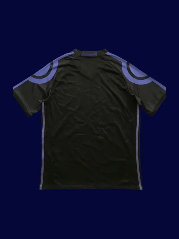back view of black third retro football jersey (16/17) showing plain back panel and number-ready surface.
